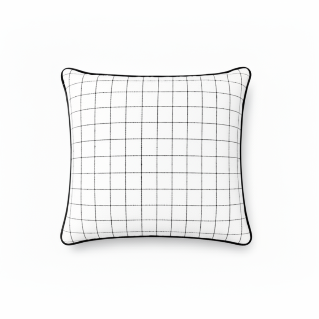 A square white throw pillow with a black grid pattern and a black piped edge, shown against a plain white background.