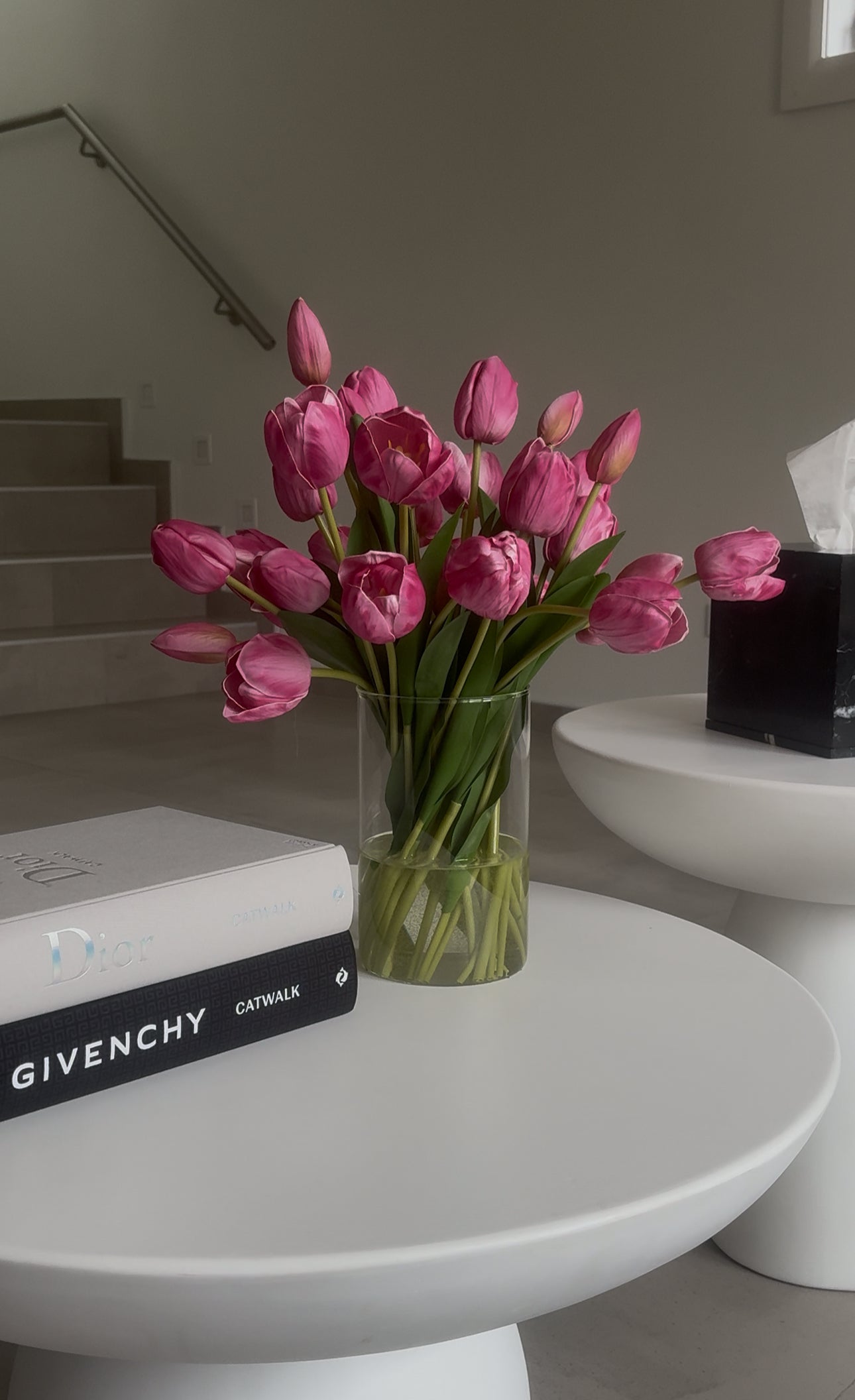 pink tulip arrangement on coffee table