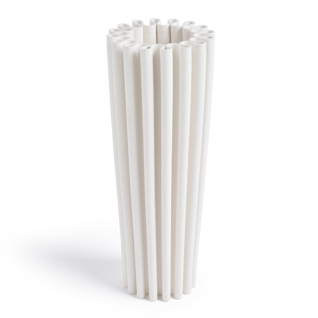 A modern cylindrical white ceramic vase with wave-like curves.