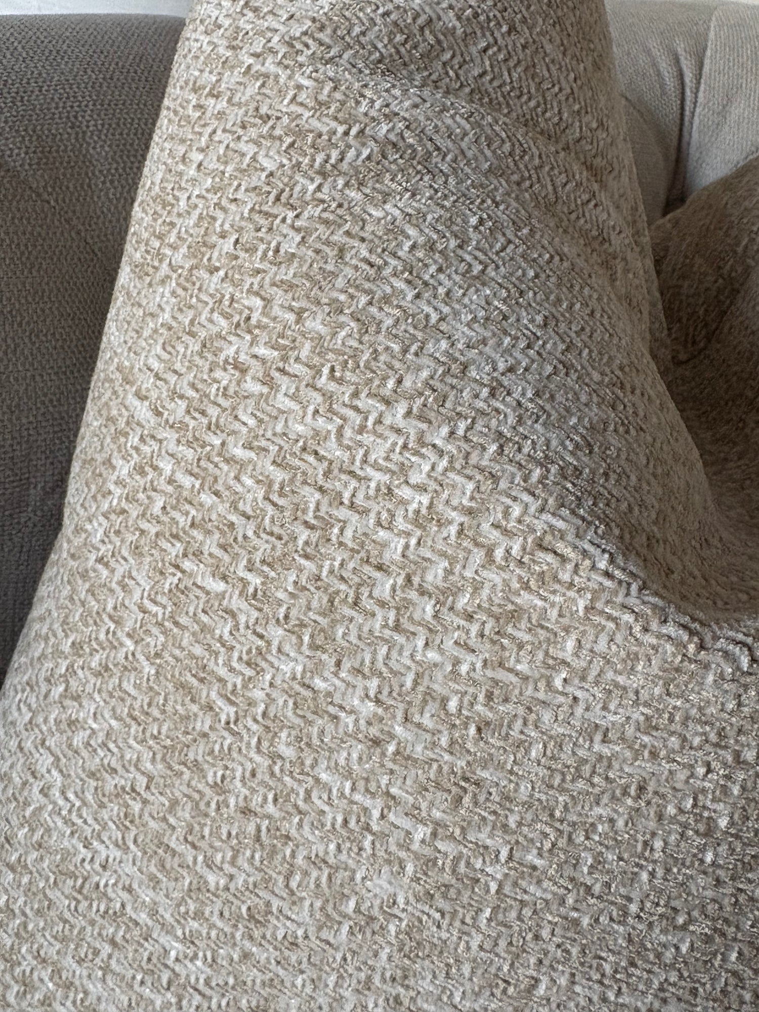 A close-up of a woven throw PILLOW 