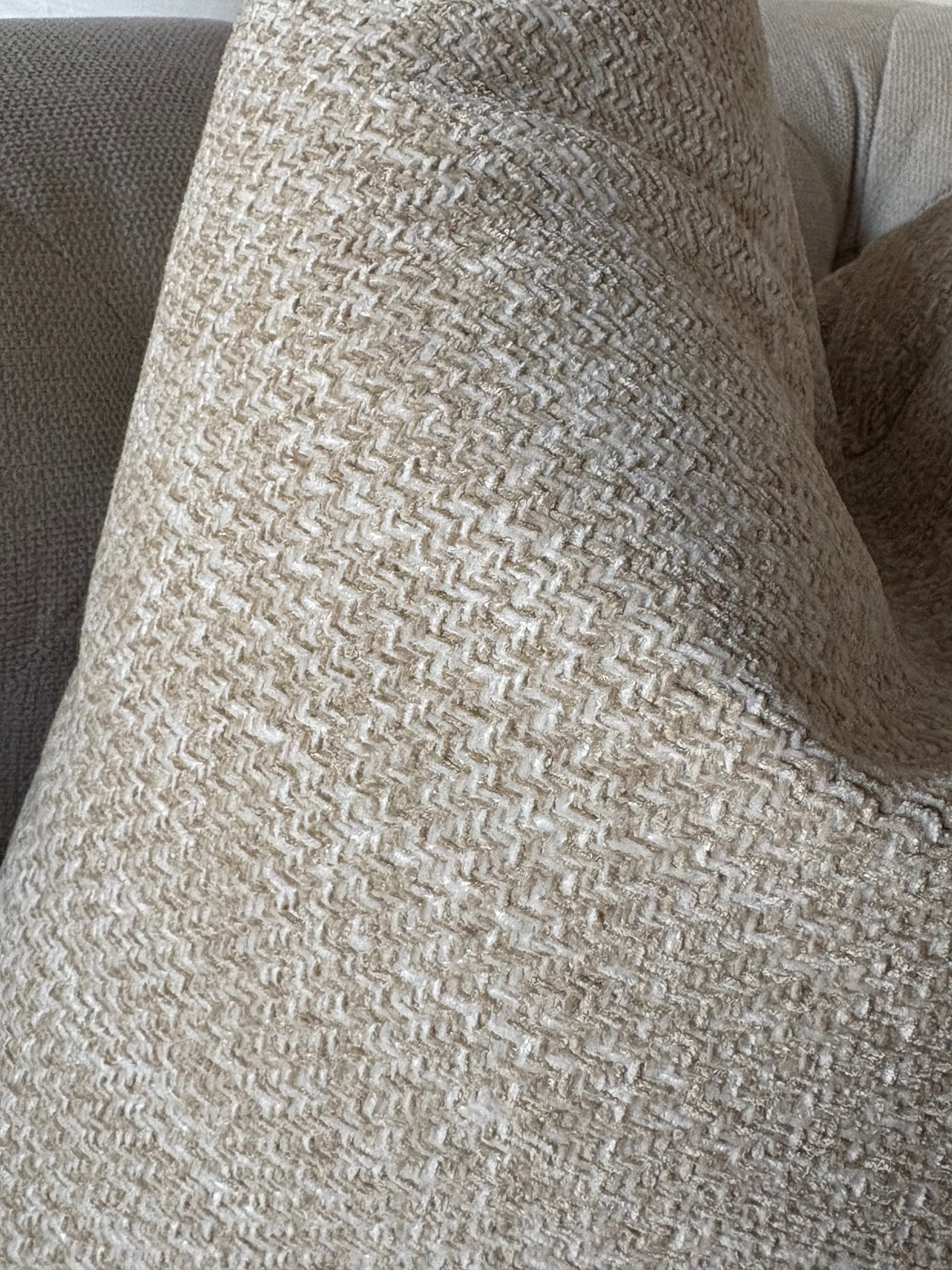 A close-up of a woven throw PILLOW 