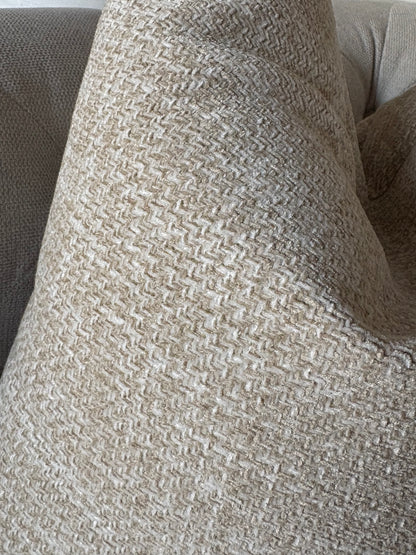 A close-up of a woven throw PILLOW 