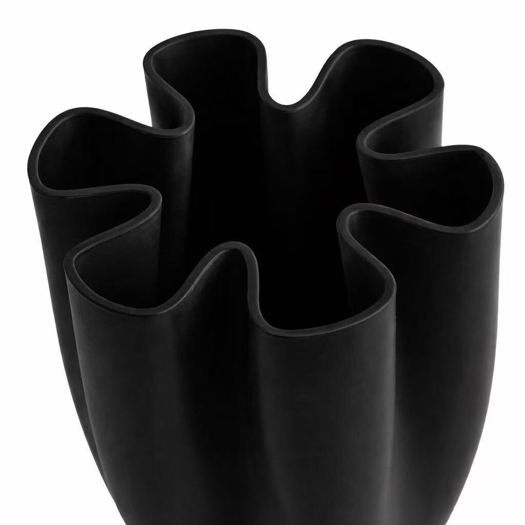 Black wavy vase on a white background