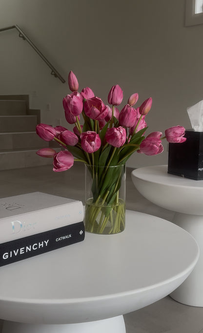pink tulip arrangement on coffee table